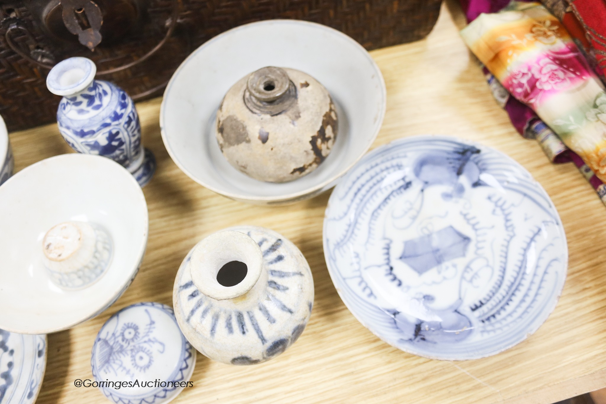 A collection of Chinese and Annamese shipwreck ceramics, Song to 19th century including bowls and vases, together with two graduated wicker baskets